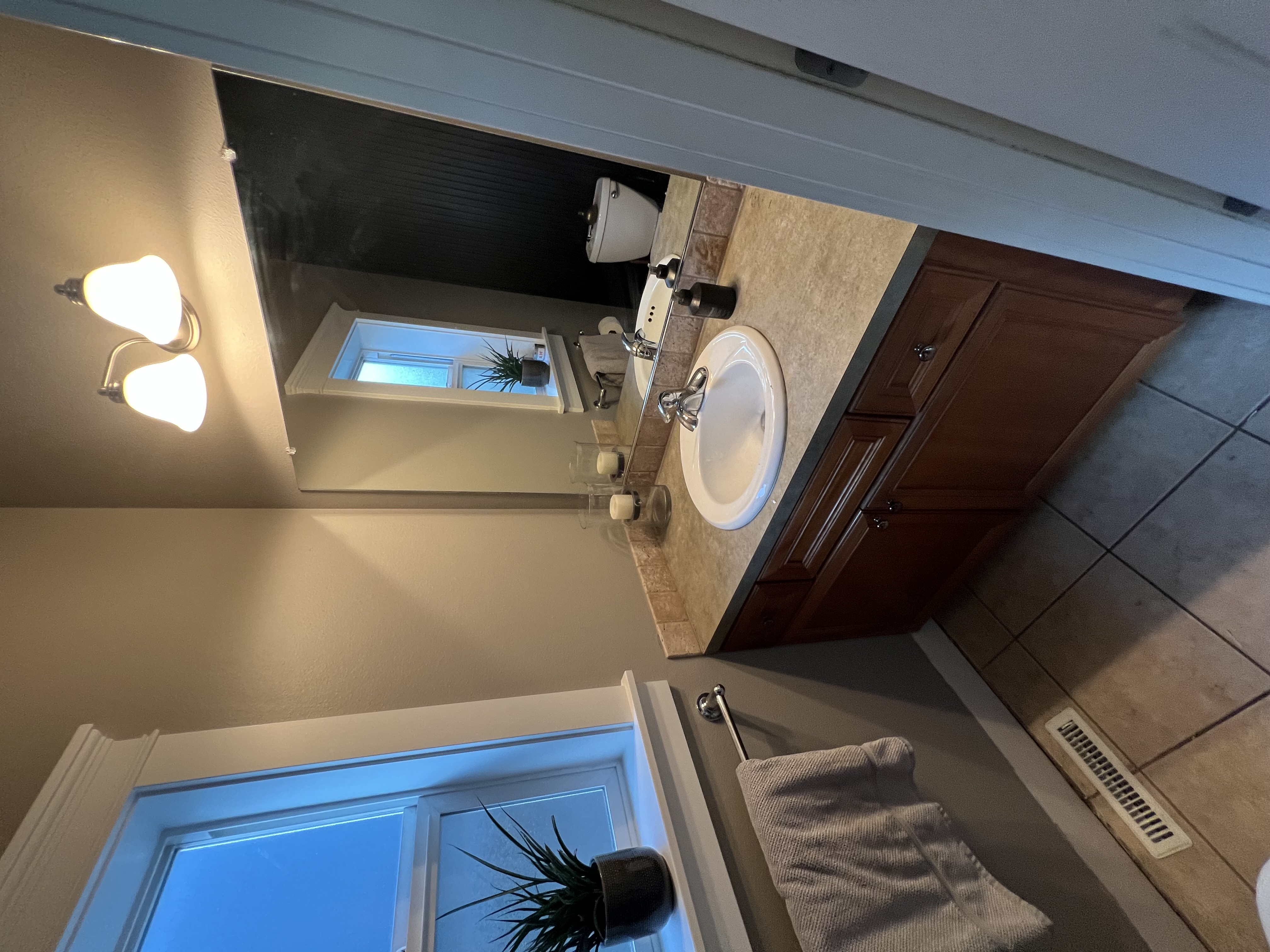 Half-bath remodel tile and fixtures